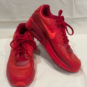 Red Nike sneakers. Like new (worn once). Size 6 Youth or Women’s size 8.